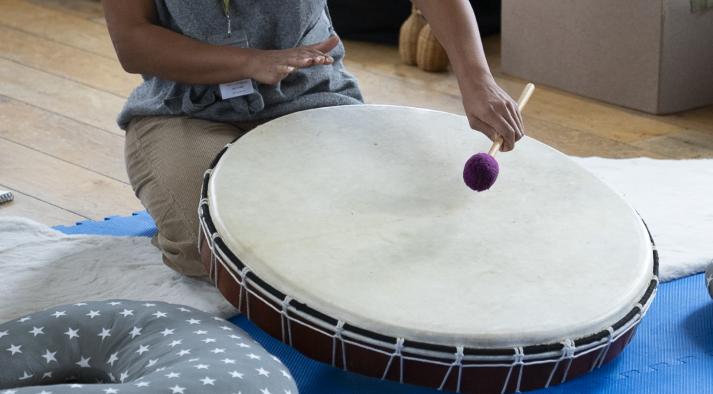 Zoë Palmer playing the drum